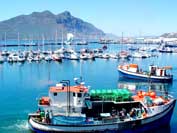 Vessels leaving the peer of the Hout Bay harbour after offloading